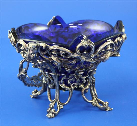 An early Victorian cast pierced silver sugar basket by Elkington & Co, 13 oz.